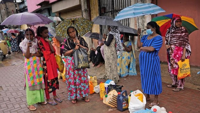 Sri Lanka says economy collapsed, pins last hopes on IMF