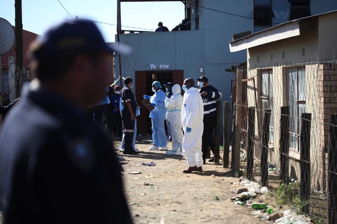 South African police search bar for clues after 21 teens die