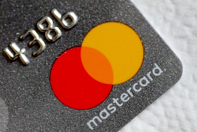 A Mastercard logo is seen on a credit card in this picture illustration. (REUTERS)