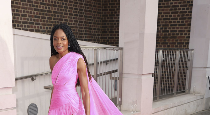 Actress Naomie Harris shows off pink gown by Tony Ward at grand prix ball