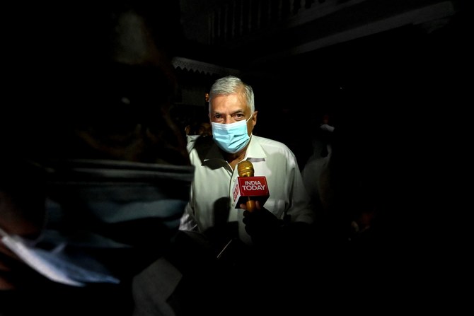 Sri Lankan Prime Minister Wickremesinghe takes power as president flees