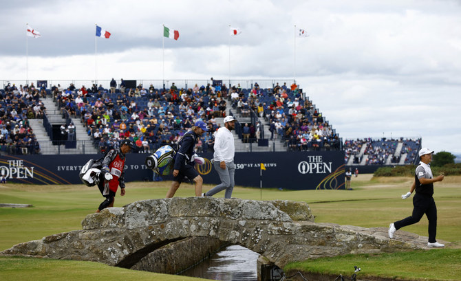 Young leads from McIlroy at British Open but woe for Woods