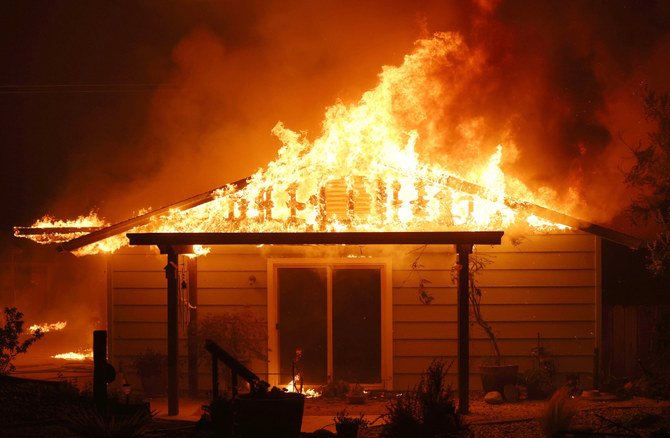 A home burns as the Oak Fire moves through the area on July 23, 2022 near Mariposa, California. (AFP)