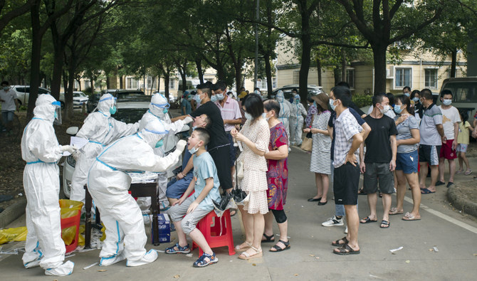Residents line up to be tested for COVID-19 in Wuhan, central China's Hubei province on Aug. 3, 2021. (AP)