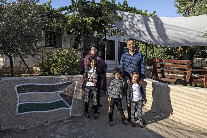 Palestinian family encircled by Israeli settlement