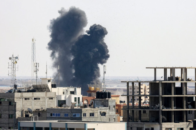 Smoke billows from a building struck during an Israeli air strike in Rafah in the southern Gaza Strip, on August 7, 2022. (AFP)