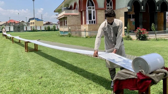 Kashmiri calligrapher’s 500-meter Qur’an sets record amid hopes for Middle East visit