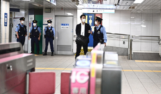 Police stand guard inside a train station near the prime minister office in Tokyo. (AFP file photo)