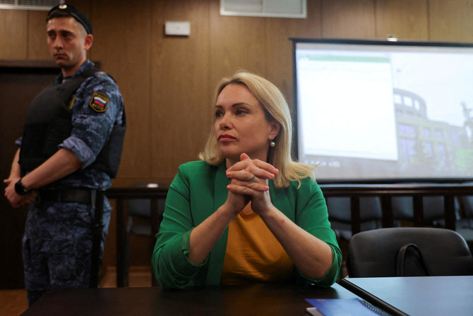 Russian journalist who fled house arrest says she is innocent