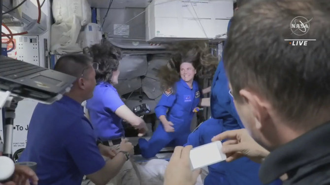 Latest 4-member SpaceX crew, including cosmonaut, welcomed aboard space station