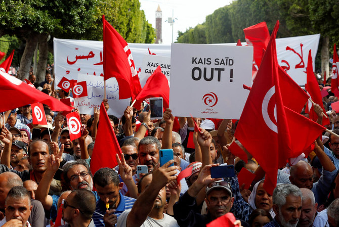 Thousands from rival Tunisian parties protest against president
