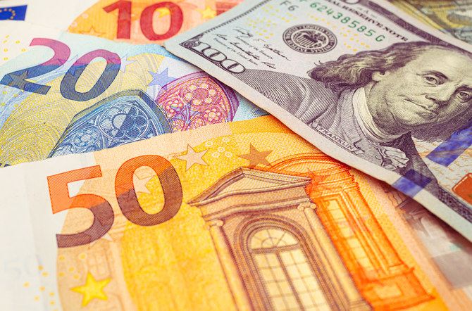 Euro back above dollar parity on US economic strains