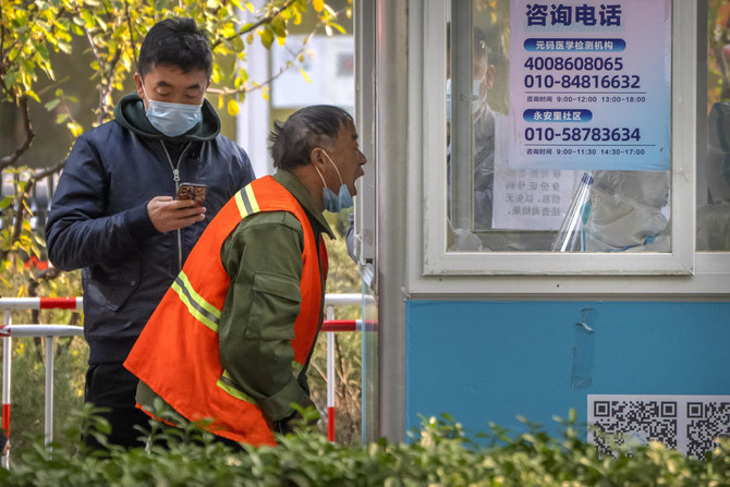 China warns against extra ‘layers’ of COVID-19 curbs as outbreaks widen