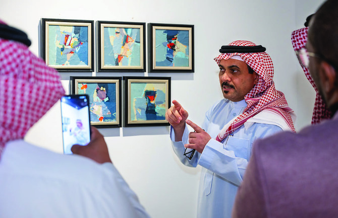Founder of Mono Gallery, Momen Al-Muslimani, explains the untitled work of Fahad Al-Hajailan. (Supplied by Mohammad Fattal)