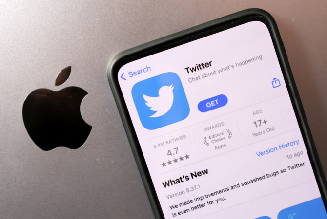 Smartphone with displayed Twitter app is seen placed on Apple logo in this illustration taken, November 29, 2022. (REUTERS)