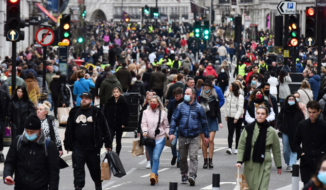 Shoppers and pedestrians are seen on the newly pedestrianized Regent Street in London. (AFP)