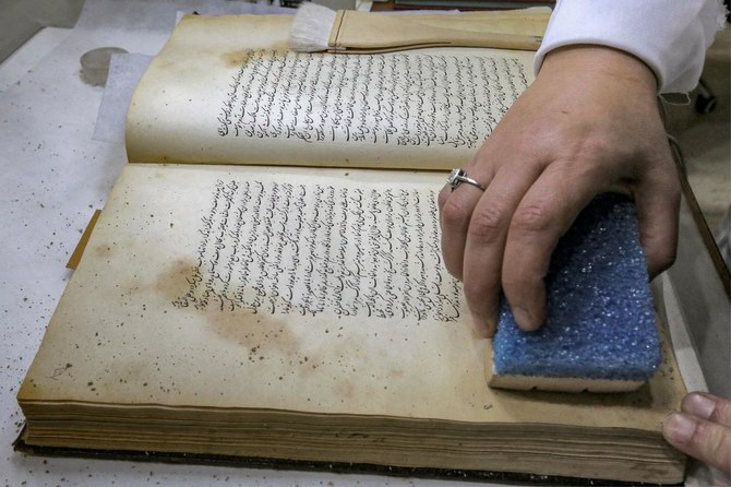 Iraqi conservators strive to preserve ancient manuscripts