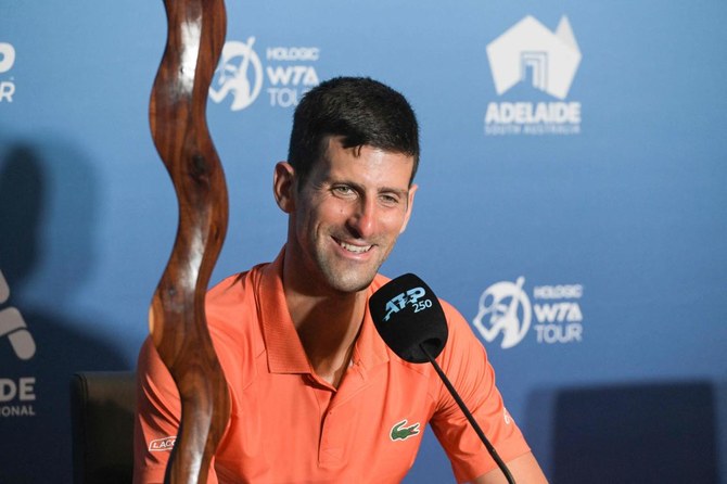 Djokovic survives marathon before winning Adelaide title