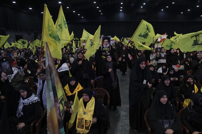 Supporters of Hezbollah attend a speech by the group’s leader Hassan Nasrallah in Beirut’s southern suburbs. (File/AFP)