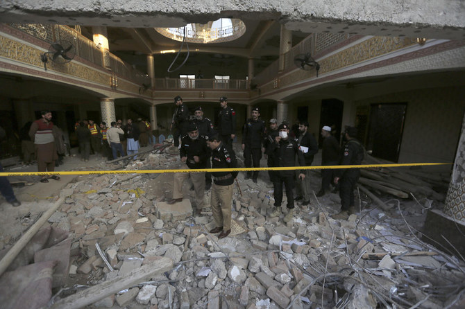 Pakistan blames 'security lapse' for mosque blast, 100 dead