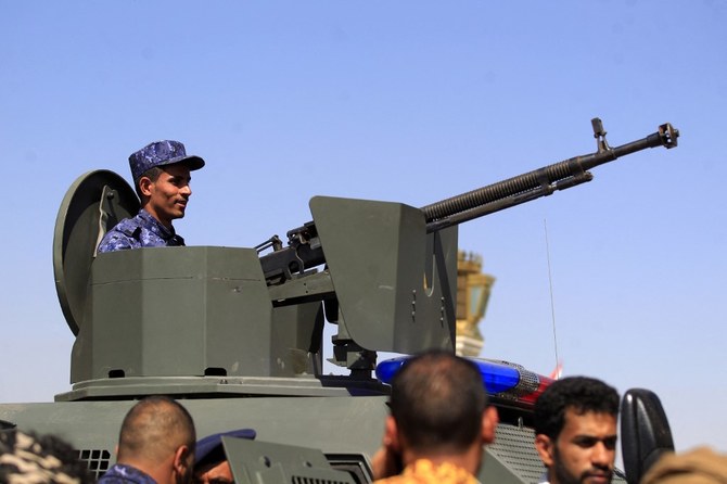 A Houthi fighter mans a turret in an armoured technical vehicle in Sanaa. (File/AFP)