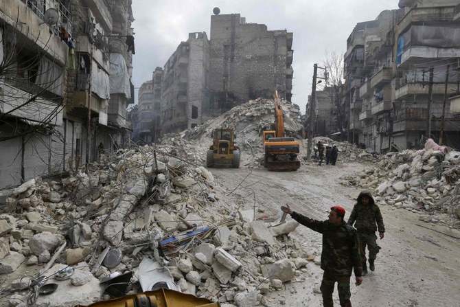 Syrian rescue teams search for victims and survivors in the city of Hama on February 6, 2023. (AFP)