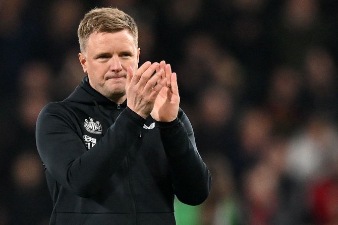 Newcastle United's English head coach Eddie Howe applauds the fans following the match.
