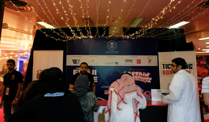 Staff sell tickets at the first Saudi cinema in Jeddah. (REUTERS)