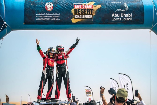 Saudi's Yazeed Al-Rajhi and German partner Timo Gottschalk celebrate winning the Abu Dhabi Desert Challenge.