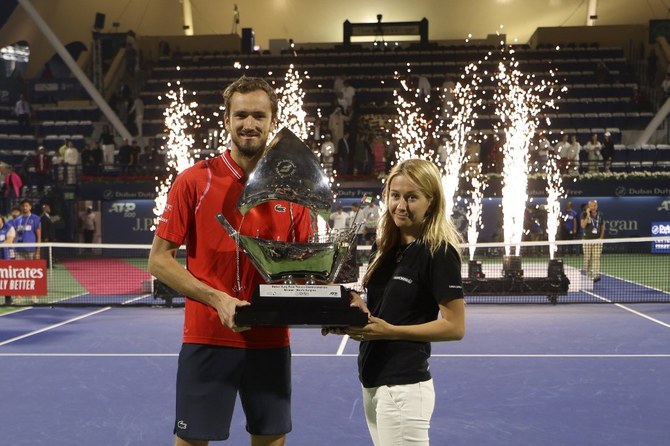Daniil Medvedev accompanied by his wife after winning in the ATP Dubai Duty Free Tennis Championship final in Dubai.