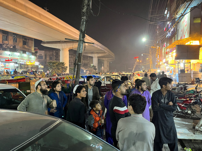 People come out of a restaurant after a tremor was felt in Lahore, Pakistan March 21, 2023. (Reuters)