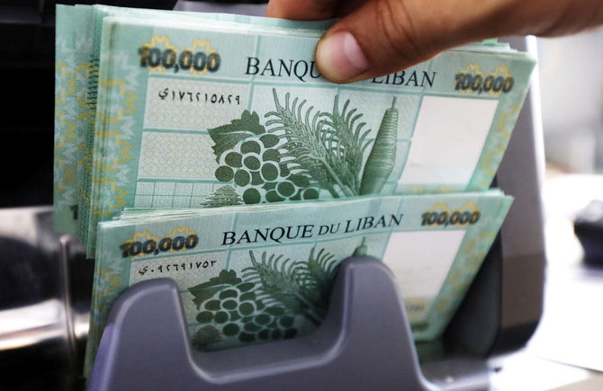 Lebanese pound banknotes are seen at a currency exchange shop in Beirut, Lebanon. (REUTERS)