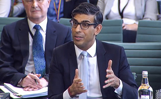 Britain's Prime Minister Rishi Sunak, gesturing as he answers questions by members of the Parliament of the Liaison Committee