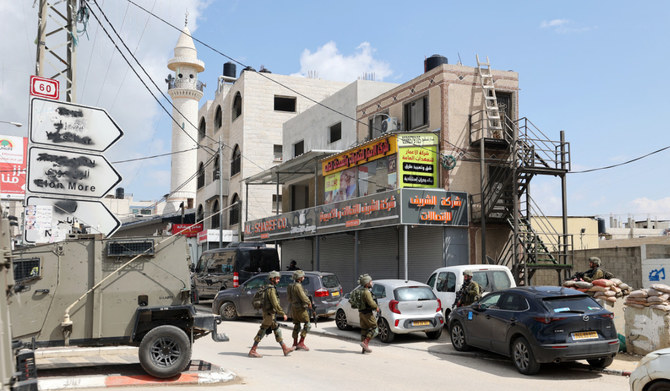 Israeli security forces patrol in the West Bank town of Huwara, on March 26, 2023. (AFP)