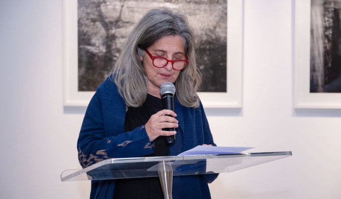 Marianne Catzaras recites poetry in her photography exhibition, "Beyond Time", at L’Art Pur Gallery in Riyadh. (Supplied)