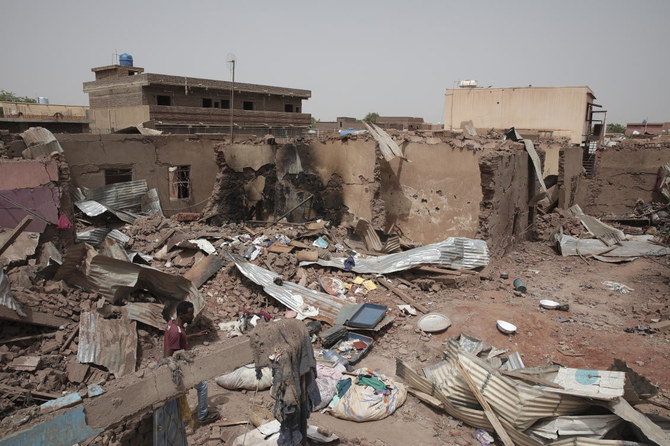 A man walks by a house hit in recent fighting in Khartoum, Sudan, Tuesday, April 25, 2023. (AP)