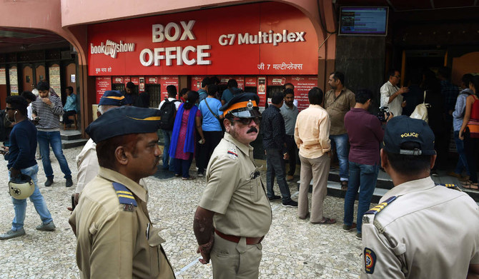  Indian policemen stand guard outside the cinema hall in Mumbai.  (AFP file photo)