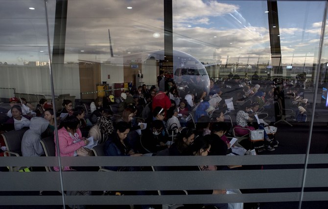 Filipino workers returning home from Kuwait arrive at Manila International Airport. (File/AFP)