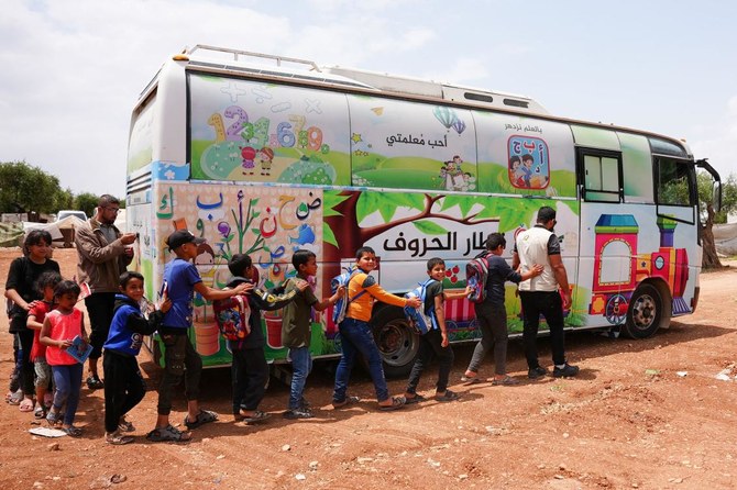 Children in quake-hit Syria learn in buses turned classrooms
