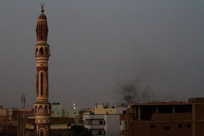 Smoke billows behind buildings in southern Khartoum, on May 27, 2023, amid= fighting between the forces of two rival generals. 