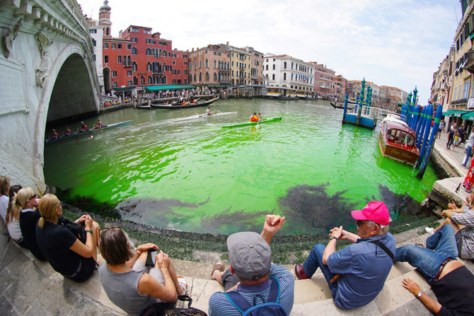 Venice’s Grand Canal turns bright green due to fluorescein