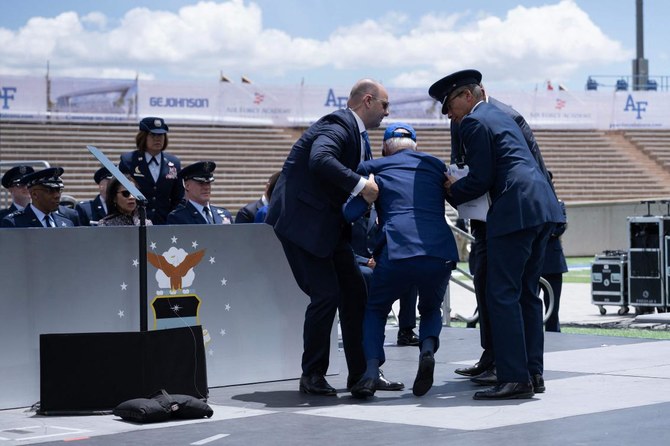 Biden trips, tumbles on Air Force stage