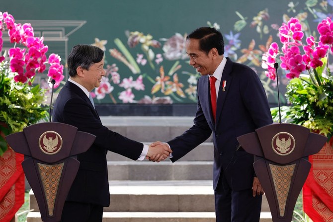 Indonesian President Joko Widodo, right, shakes hands with Japan’s Emperor Naruhito following a joint press conference in Bogor.