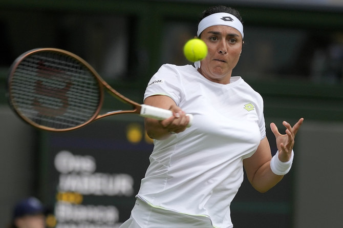 Tunisia's Ons Jabeur returns to Canada's Bianca Andreescu in a women's singles match on day six of Wimbledon