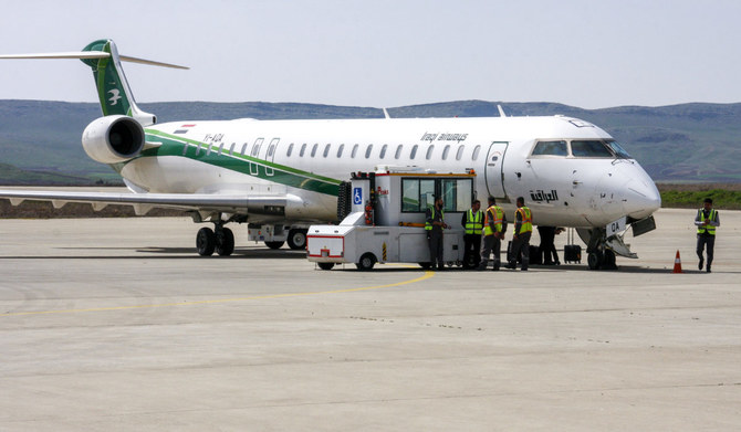 An Iraqi Airways Canadair CRJ-900 jet plane on the tarmac at the airport in the Iraqi Kurdish city of Sulaimaniyah. (AFP)