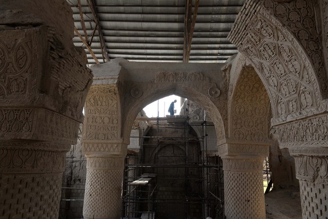 An Afghan laborer works at the ninth-century Noh Gonbad mosque in Balkh province. (File/AFP)