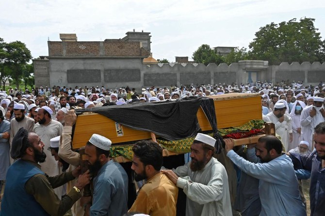 People carry the coffin of a victim who died in a bomb blast in Bajaur district of Khyber-Pakhtunkhwa province on July 31, 2023.