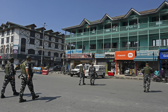 Indian paramilitary troopers patrol along a street in Srinagar. (File/AFP)