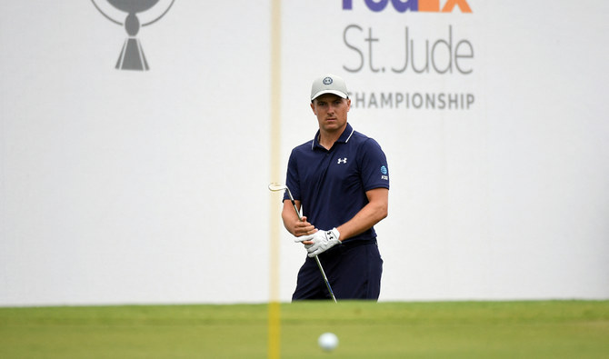 Jordan Spieth keeps a clean card in the mud for a 63 to lead the PGA Tour playoff opener