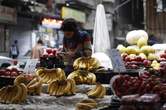 A shopkeeper waits for customers in Damascus, Syria. (File/AP)